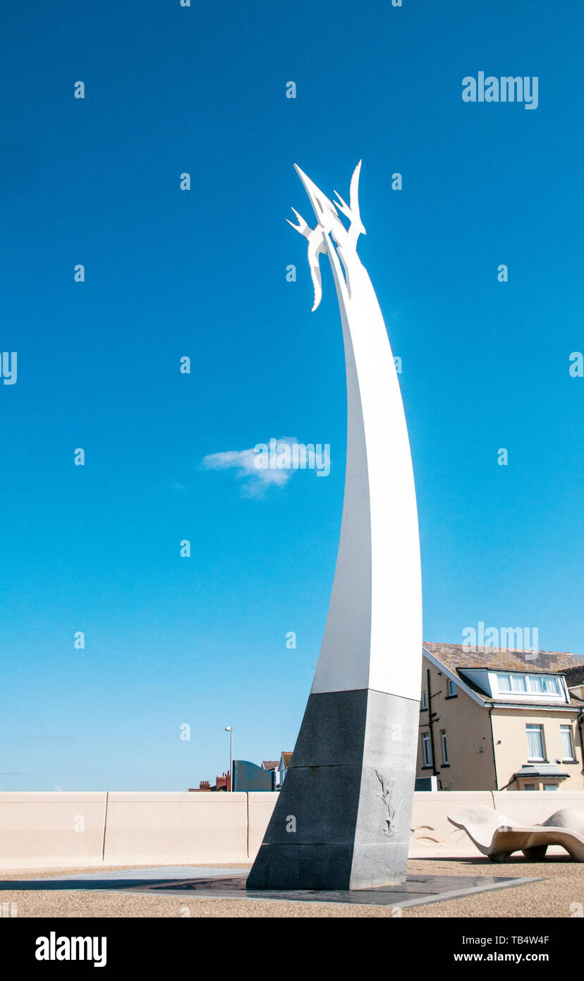 A piece of modern comtempory artwork of two large white seagulls set against a deep blue sky flying above the town of Cleveleys Lancashire England UK Stock Photo