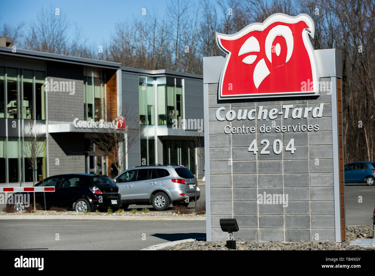 A logo sign outside of the headquarters of Alimentation Couche-Tard Inc.,  in Laval, Quebec, Canada, on April 22, 2019 Stock Photo - Alamy