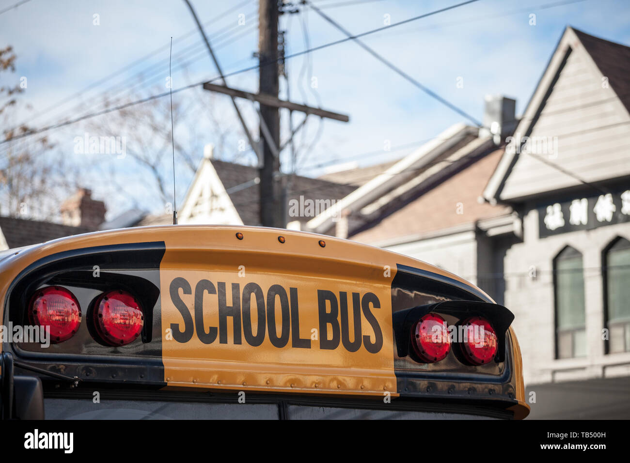 Detail of the roof of a North American Yellow School Bus parked on a street, waiting for students in a residential area of Toronto, Ontario, Canada  P Stock Photo
