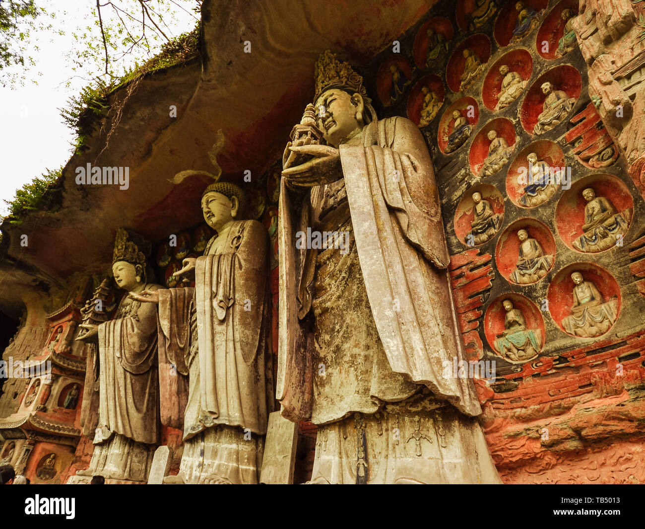 Three Worthies of Huayan, Ancient Buddhist Hillside Rock Carving - Baodingshan, Dazu, China Stock Photo