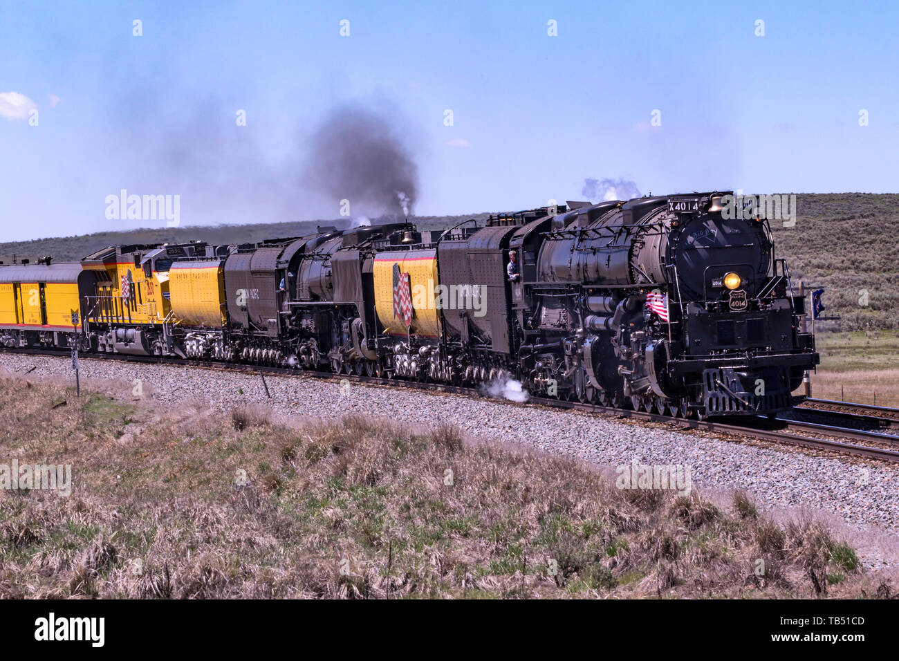 Union Pacific steam locomotives 4014, Big Boy, and 844 double-head towards Evanston, Wyoming, on their return trip to the Union Pacific Steam Shop in  Stock Photo