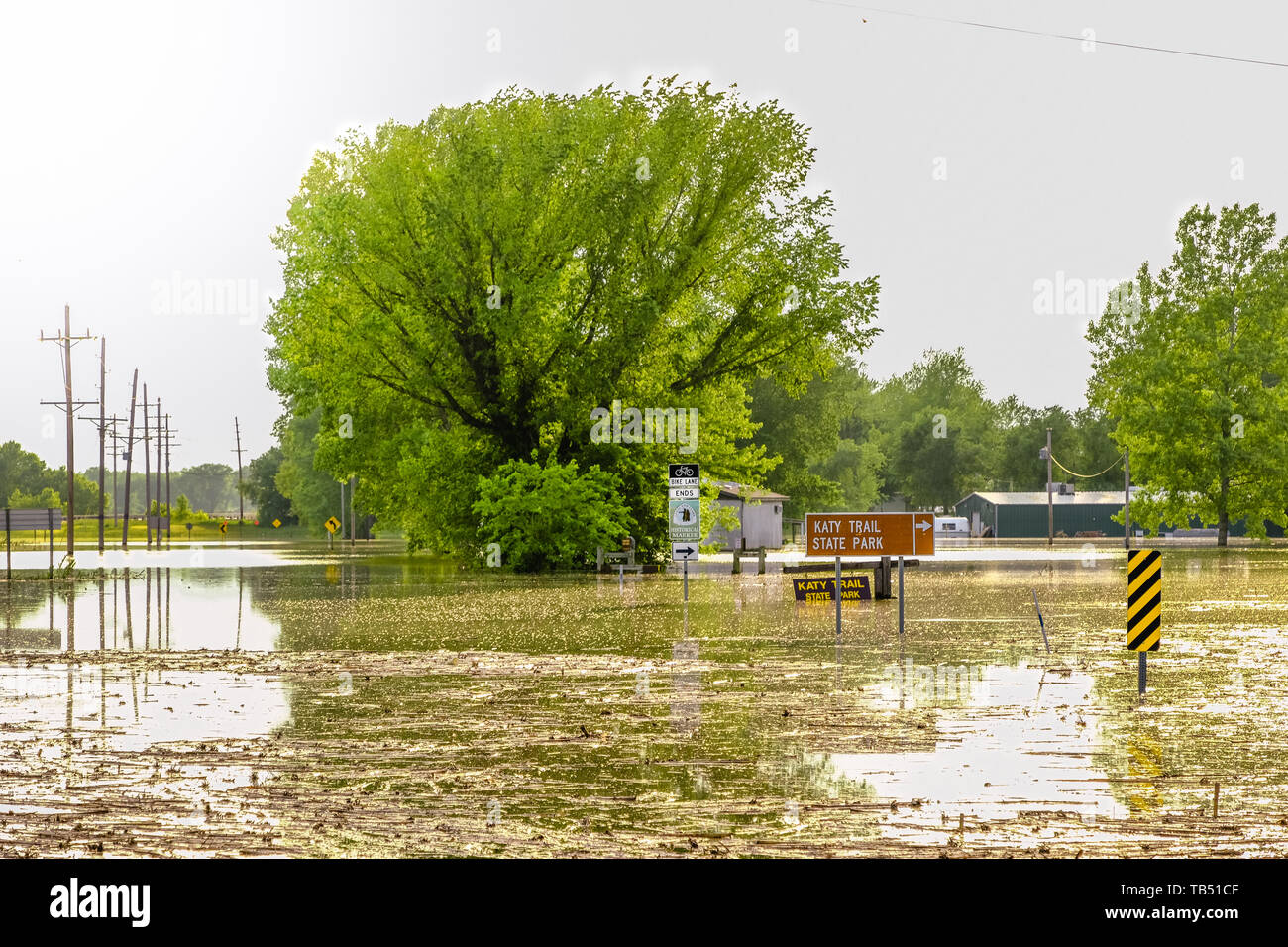 View of flooded recreational trail and road near McBain, Missouri, USA Stock Photo