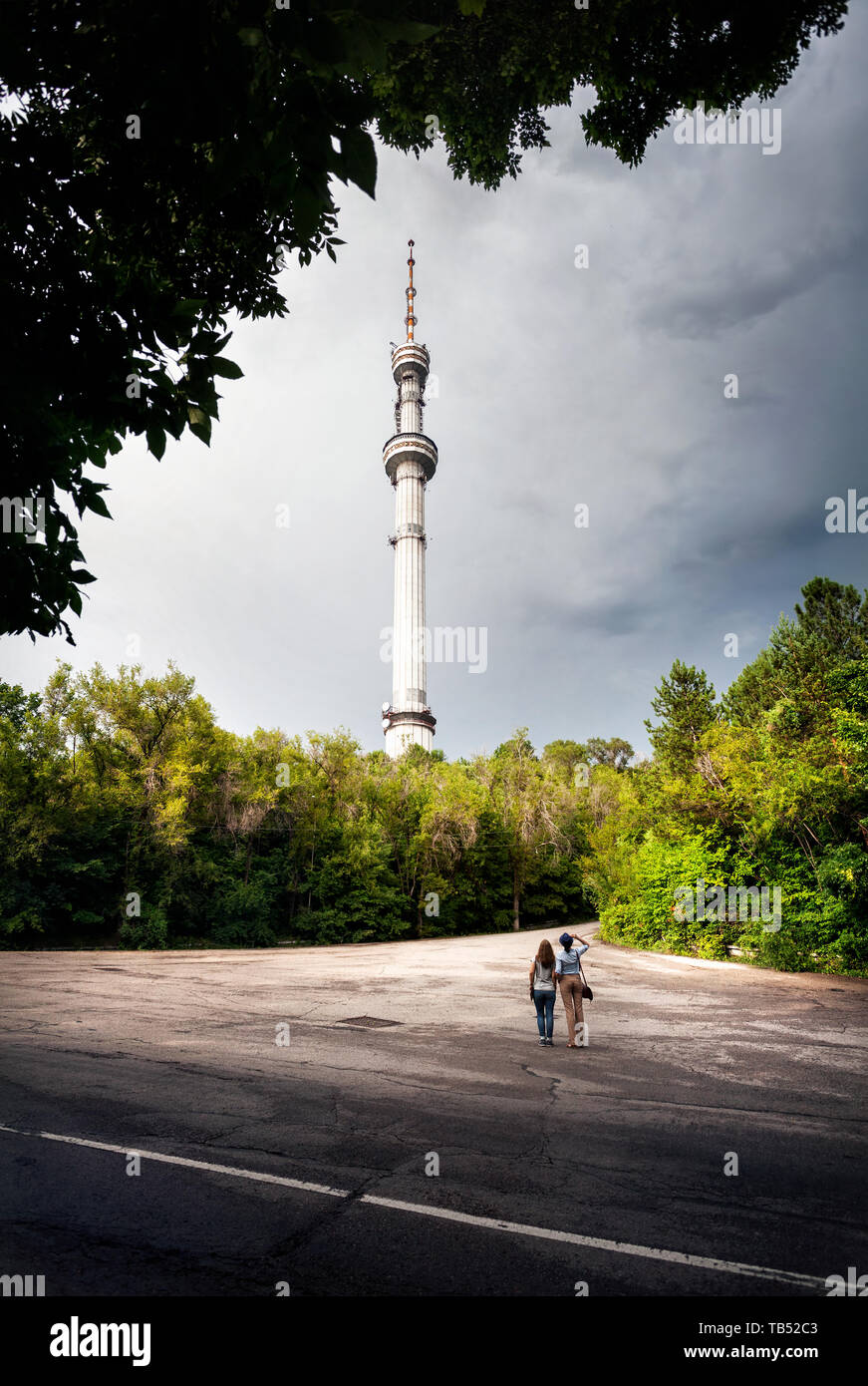 Two friends tourist looking at TV tower Kok-Tobe  in Almaty Kazakhstan Stock Photo
