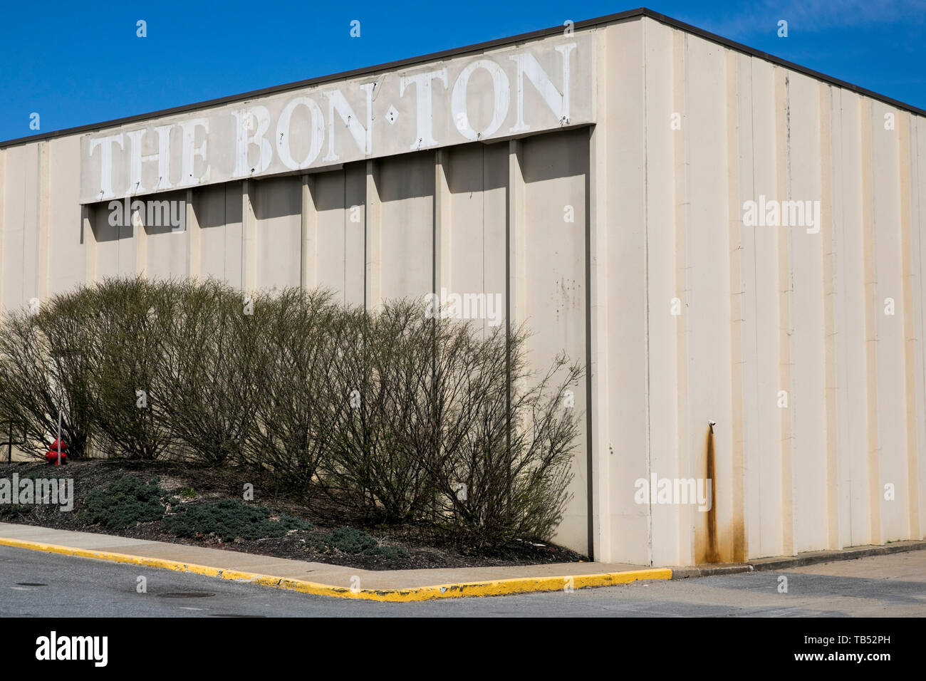 The outline of a The Bon-Ton logo sign outside of a closed retail store location in Queensbury, New York, on April 23, 2019. Stock Photo