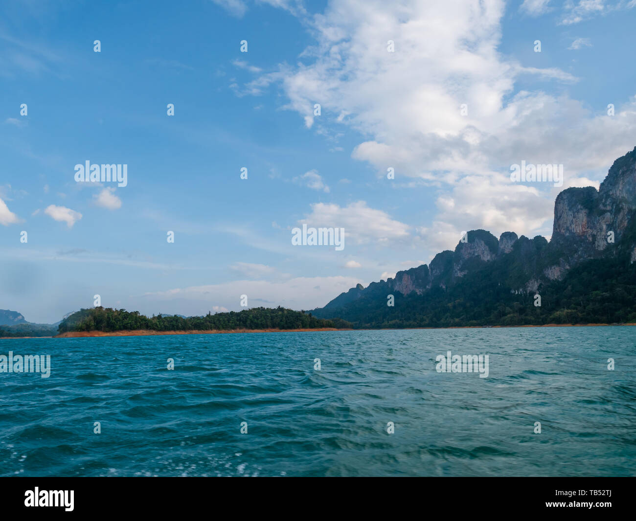 Scenic landscape of boat view in the big river and reservoir dam with mountain and nature forest Stock Photo