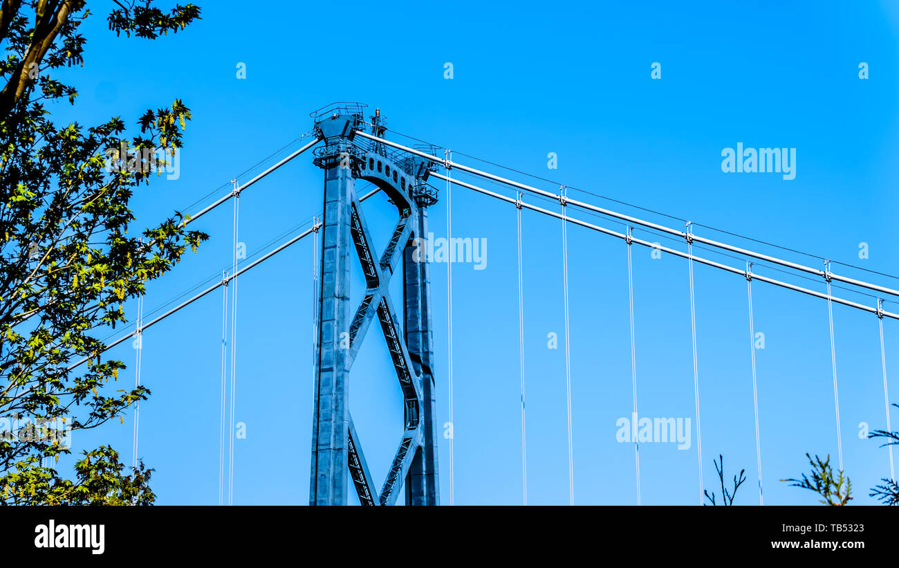 The top section of one of the riveted steel towers of the Lions Gate Bridge, or First Narrows Bridge, between Vancouver's Stanley Park and the municip Stock Photo