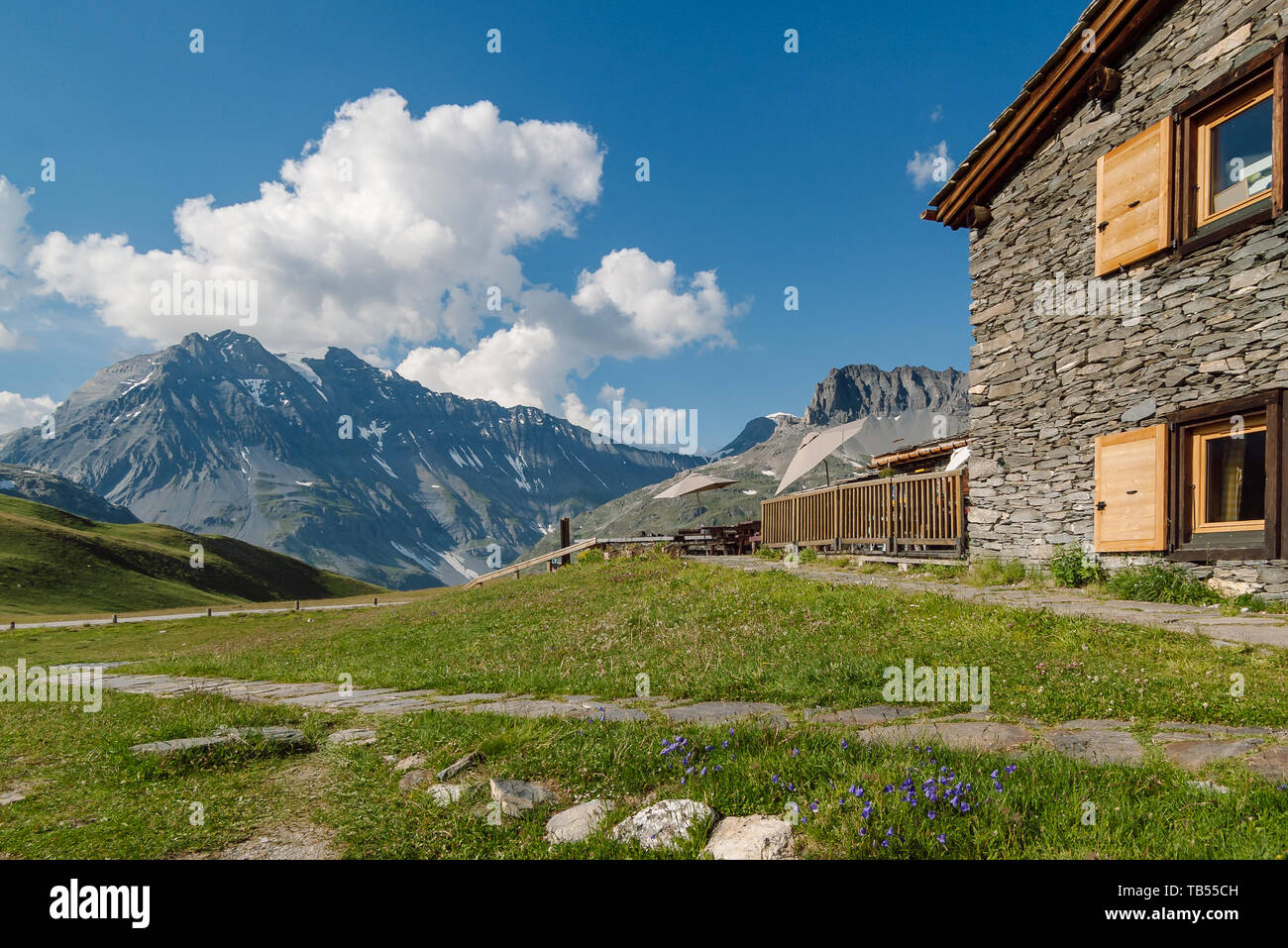 Summer Alpine landscape with mountain refuge hut (Refuge du Plan du Lac) in the Vanoise National Park, French alps. View of Grande Casse Мountain. Stock Photo