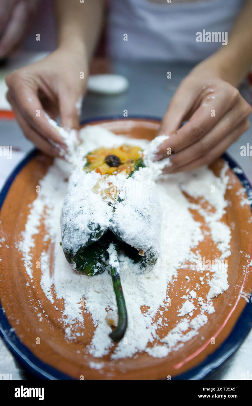 A cooking class taught by Chel Alonso Hernandez, participants learnt to make the traditional seasonal Chile En Nogada dish. Mesones Sacristia Puebla Stock Photo