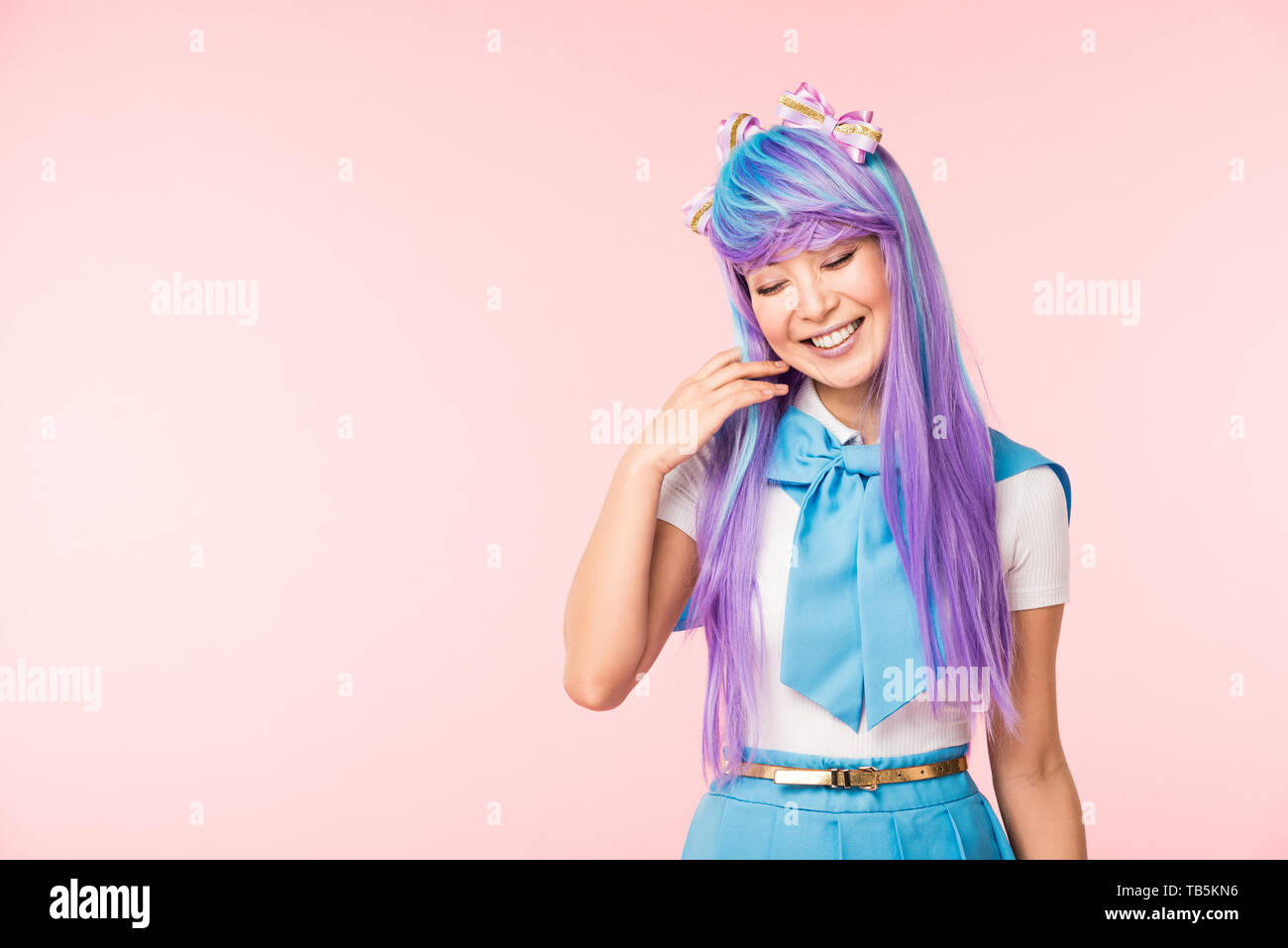 Pretty Anime Girl In Wig Smiling With Closed Eyes Isolated On Pink Stock Photo Alamy