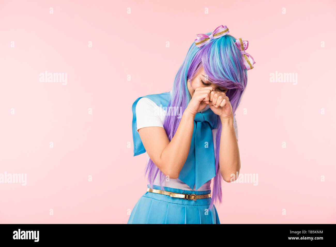 Sad anime girl in wig crying isolated on pink Stock Photo - Alamy