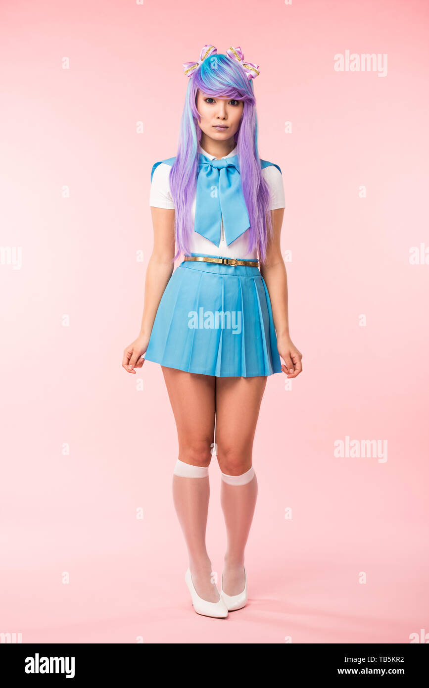 Full length view of sad asian anime girl standing on pink Stock Photo -  Alamy