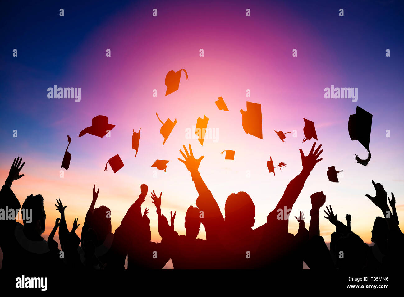 Graduation caps in air hi-res stock photography and images - Alamy