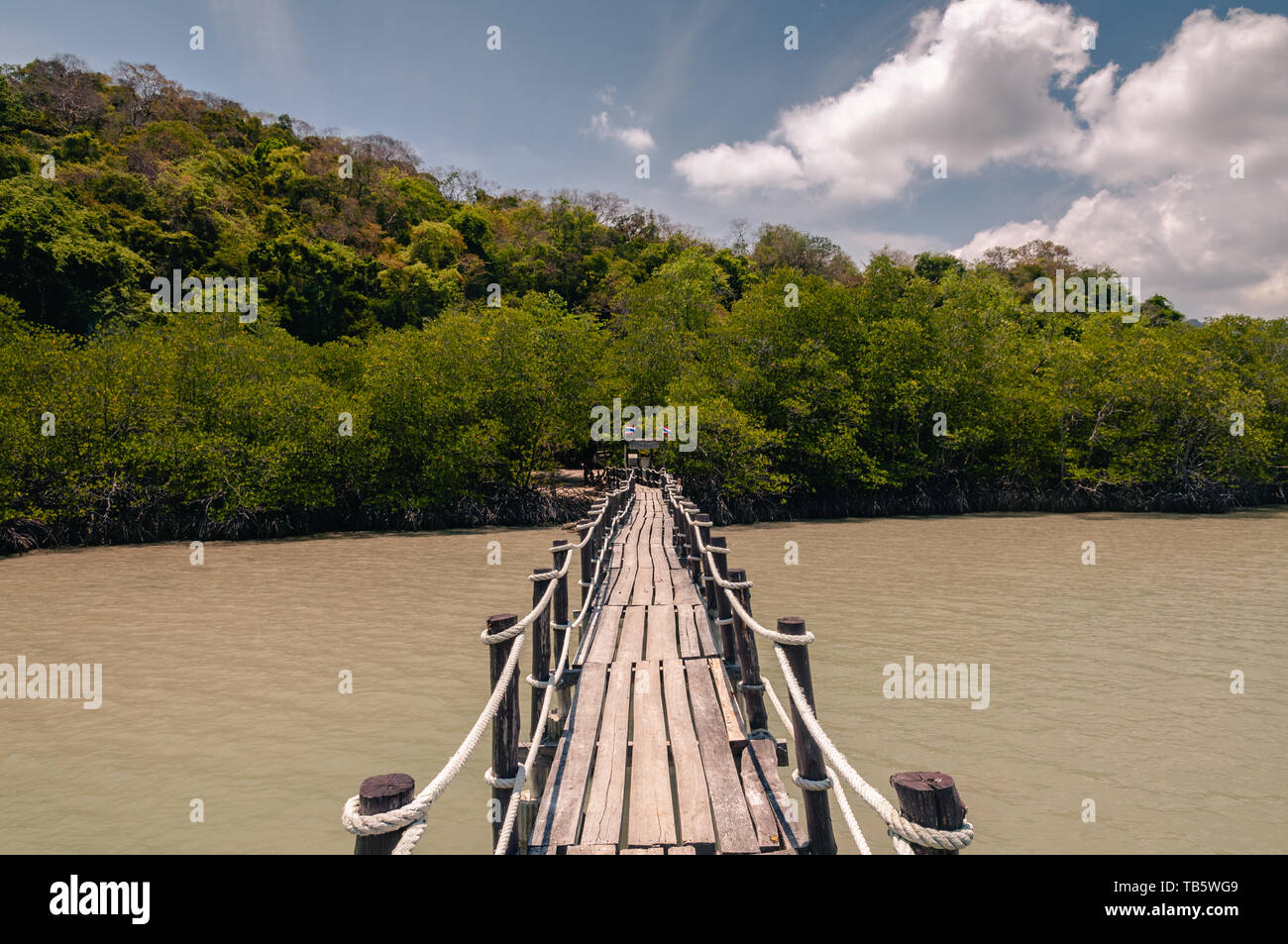Wooden pier and thai long tail boats in Talet bay at Nakhon Si Thammarat province of Thailand. Stock Photo