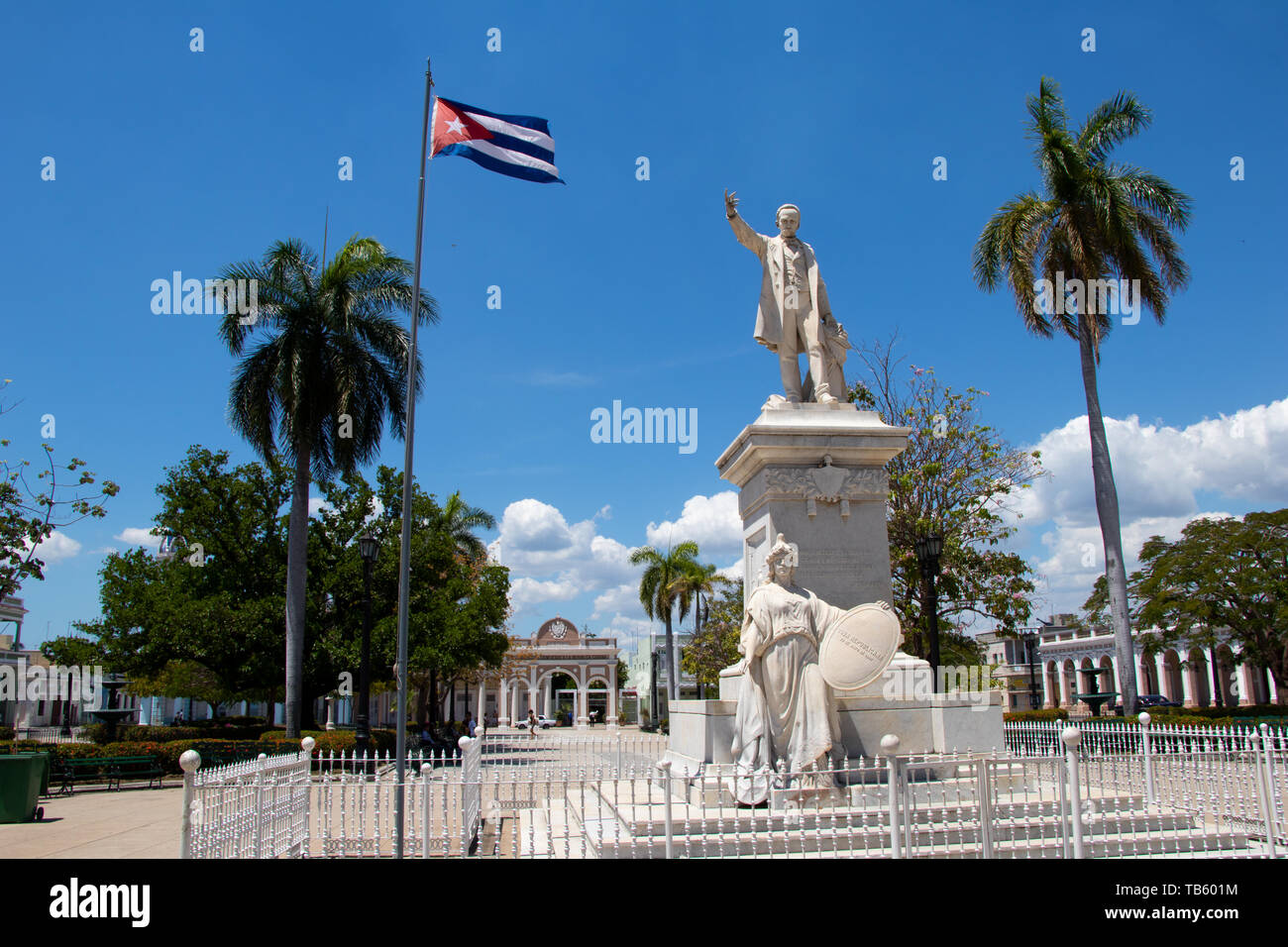 Statue of Jose Marti in the Jose Marti square with Cuban flag in Cienfuegos, Cuba Stock Photo