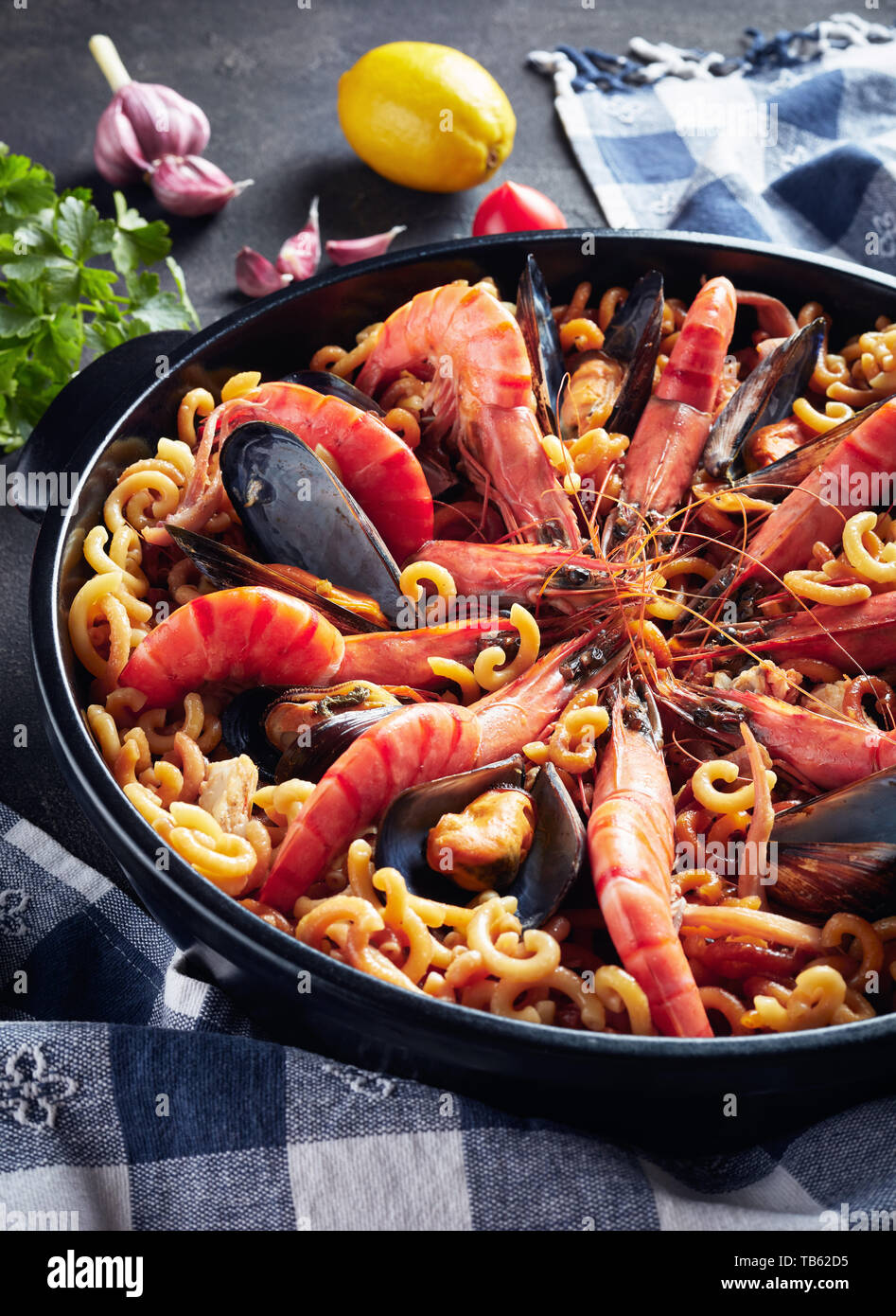 a spanish fideua, a typical noodles casserole with seafood Stock Photo -  Alamy