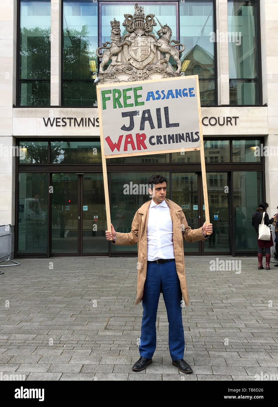 A lone Julian Assange supporter outside Westminster Magistrates Court where the WikiLeaks founder is expected to appear via videolink as he continues to fight against extradition to the United States over allegations he conspired to break into a classified Pentagon computer. Stock Photo