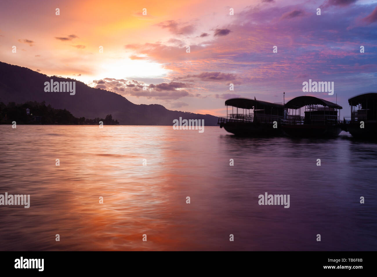 Sunset over Tuk Tuk peninsula, Samosir Island, Lake Toba, Sumatra, Indonesia Stock Photo