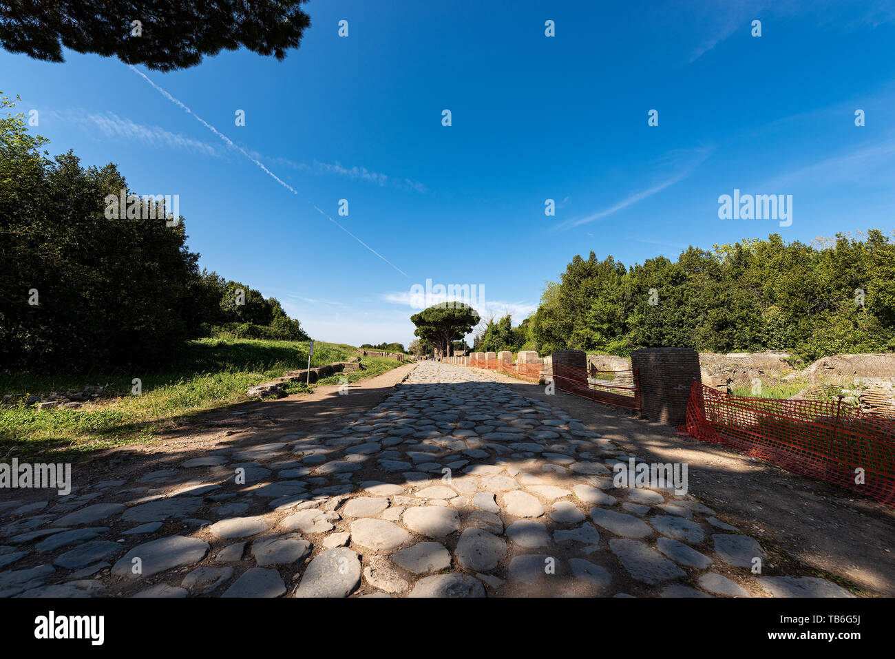 Decumanus Maximus, ancient Roman road in Ostia Antica, colony founded in the VII century BC. Archeological siteÂ in Rome, UNESCO world heritage site.  Stock Photo