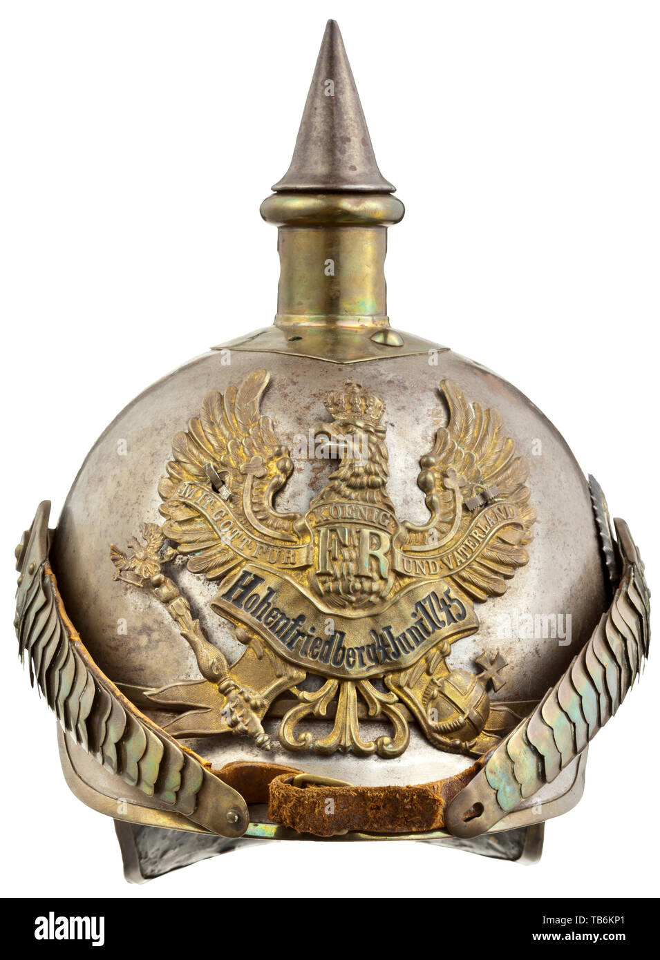 A helmet M 1894 for enlisted men in the Königin Cuirassier Regiment (Pomeranian) no. 2 Hohenfriedberg, Nickel plated iron skull, humped rivets, oval base plate with removable iron spike, helmet emblem with bandeau 'Hohenfriedberg 4 Juni 1745'. Convex chin scales with M 91 button, Reich cockade. Leather helmet liner. Heavy signs of age, a few defective pieces and damage, probably a converted older helmet. Easy to improve with expert restoration. Prussian, Prussia, German, Germany, militaria, military, object, objects, stills, clipping, clippings, , Additional-Rights-Clearance-Info-Not-Available Stock Photo