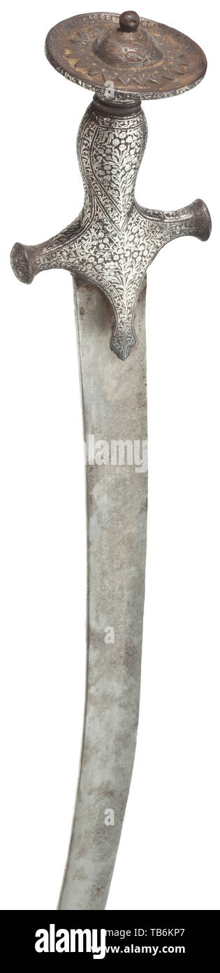 An Indian tulwar, 19th century, Curved wootz Damascus blade, slightly over-polished. Characteristically shaped hilt profusely covered with rich silver ornaments. Wooden scabbard covered with red leather, iron chape. Length 90 cm. historic, historical 19th century, Additional-Rights-Clearance-Info-Not-Available Stock Photo