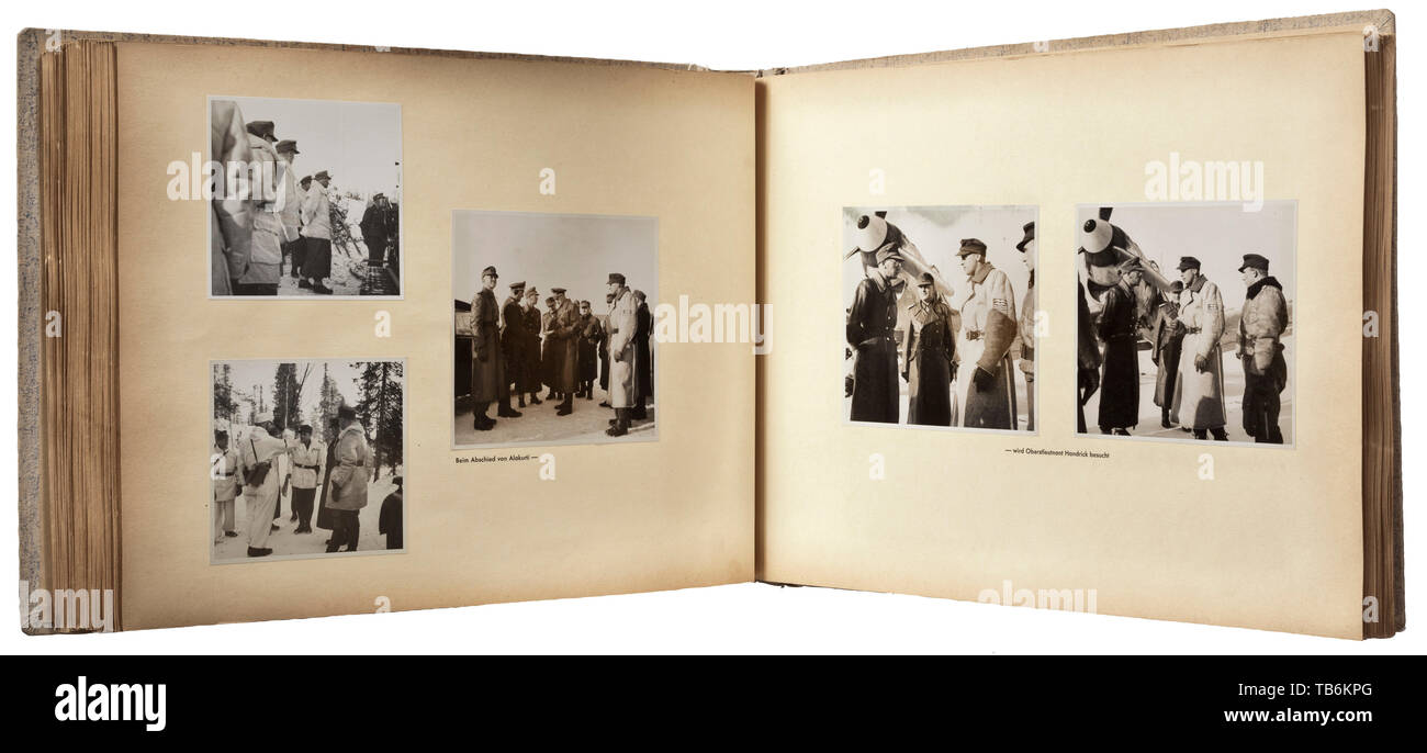 A presented photo album to Josef Terboven (1898 - 1945), Gauleiter of Essen and Reich Commissioner (RK) for Norway, The large-format album has a total of circa 320 photos from the trip of RK J. Tervoben to Norway, Lapland and Karelia in the spring of 1943. Cover (loosened) of linen-covered cardboard, the flyleaf and photo pages with printed descriptions. Shown are the RK visiting troops in Norway, good naval technical images and photos from Tromsö, Engerlö, Narvik, Rundhaug, Djupvik, Kvenangen, Alta, Hammerfest, Banak, Skoganvarra, Alakurt and other locations. Also, meeting, Editorial-Use-Only Stock Photo