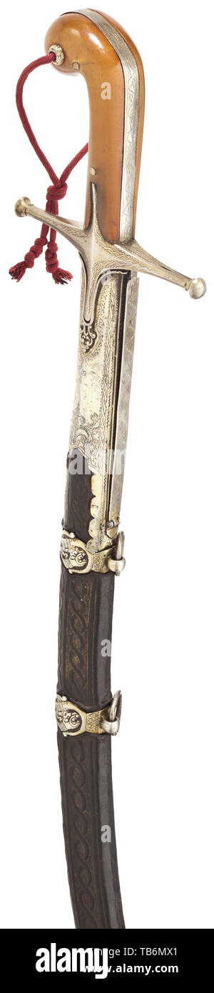An Ottoman silver-mounted kilij, circa 1800, Curved single-edged blade of Sham Damascus with a broad, double-edged point. The quillons with geometric engravings, the grip frame of silver with riveted horn grip panels and attached hand loop. The wooden scabbard covered with shagreen leather, decorated with elaborate cord underlays and broadly stitched with silver wire, with florally engraved silver mounts and blade slit cover, the suspension bars with stylised dragon heads in relief. The scabbard mounts each stamped with the tughra of Selim III (1, Additional-Rights-Clearance-Info-Not-Available Stock Photo