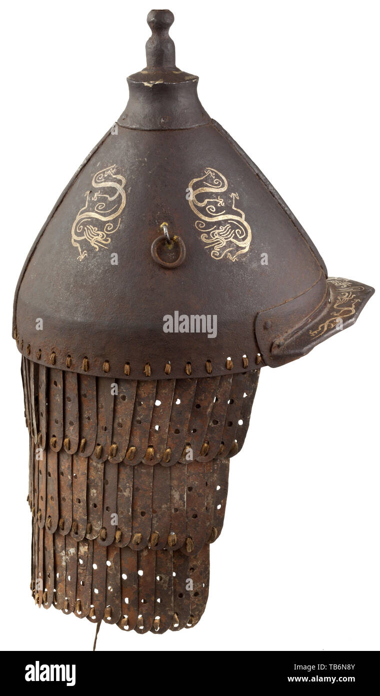A Chinese helmet, 19th century, Two-piece riveted skull with riveted top piece and plume socket, movable rings soldered to the sides. The obverse reinforced with a riveted peak to the forehead. Skull and peak with silver inlaid dragon design. Attached neck guard with lames connected by leather bands. Corroded surfaces. Height (incl. neck guard) 44 cm. China, Chinese, historic, historical 19th century, Additional-Rights-Clearance-Info-Not-Available Stock Photo