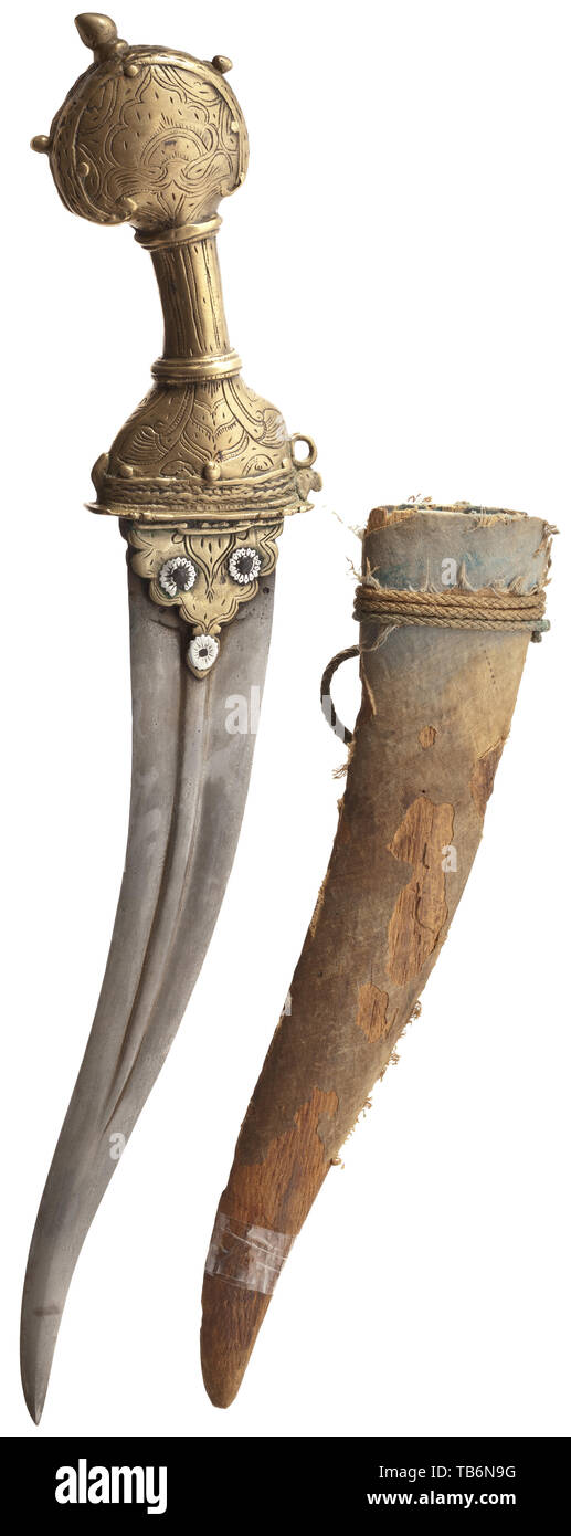 An Indian chilanum, Deccan, 17th century, Double-edged, riveted wootz Damascus blade with central ridge on both sides. Hollow bronze grip in pre-Mogul form engraved with floral ornaments and studded with silver rivets at the base of the blade. Length 43 cm. Comes with the original wooden scabbard with fragments of velvet covering. Provenance: Bikaner Armoury. historic, historical 17th century, Additional-Rights-Clearance-Info-Not-Available Stock Photo
