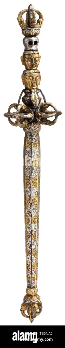 A Tibetan khatvanga with silver and gold inlays, early 15th century, Cut iron. Octagonal haft entirely covered with spiral-shaped gold and silver inlays, the lower part decorated with chiselled lotus flower in relief with a half vajra and gilt makara heads. The upper section with double vajra, followed by a kalasa, two different heads with gold and silver inlays and a skull, topped by a further vajra. Length 43.3 cm. The object at hand dates back to a significant period in the history of Tibet. During the late 14th and early 15th century the risi, Additional-Rights-Clearance-Info-Not-Available Stock Photo