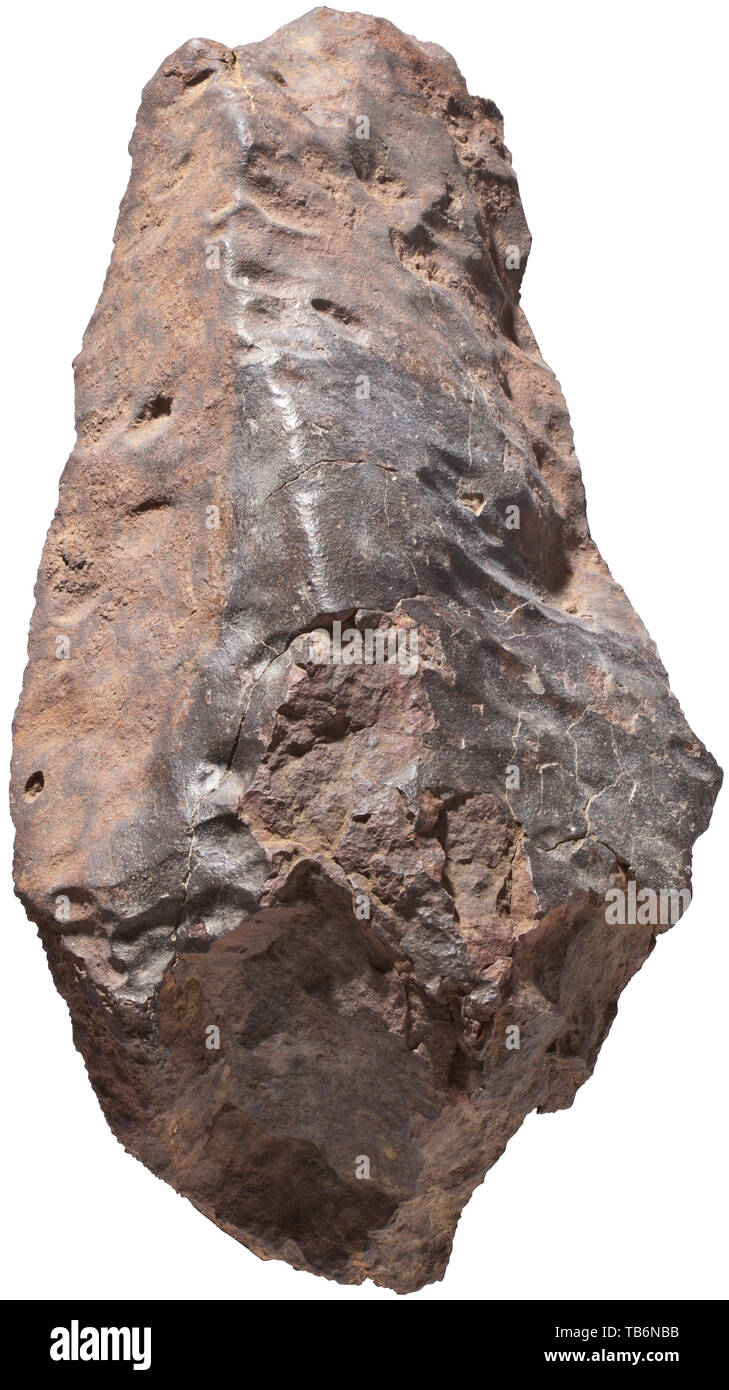 An extremely large meteorite, weighing almost 30 kg, A stony meteorite, chondrite, found in Morocco, metallic and magnetic. A large, complete, beautifully sculpted and highly impressive stony meteorite, the subgroup is not classified, untreated. Dimensions 20 x 53 x 27.5 cm, weight 29.9 kg. Dating from the early phase of the solar system, possibly originating from the asteroid belt between Mars and Jupiter, circa 4700 million years old. A meteorite of this size is of the utmost rarity. handicrafts, handcraft, craft, object, objects, stills, clipp, Additional-Rights-Clearance-Info-Not-Available Stock Photo