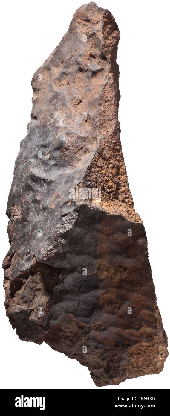 An extremely large meteorite, weighing almost 30 kg, A stony meteorite, chondrite, found in Morocco, metallic and magnetic. A large, complete, beautifully sculpted and highly impressive stony meteorite, the subgroup is not classified, untreated. Dimensions 20 x 53 x 27.5 cm, weight 29.9 kg. Dating from the early phase of the solar system, possibly originating from the asteroid belt between Mars and Jupiter, circa 4700 million years old. A meteorite of this size is of the utmost rarity. handicrafts, handcraft, craft, object, objects, stills, clipp, Additional-Rights-Clearance-Info-Not-Available Stock Photo