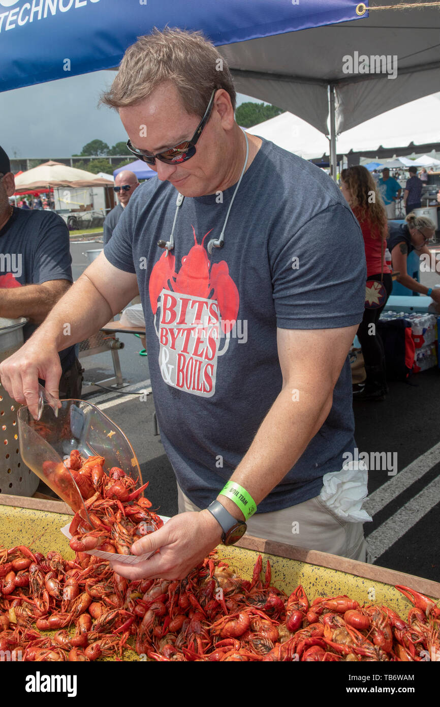 New Orleans, Louisiana - The Crawfish Mambo, an annual crawfish cook-off. Dozens of teams boil and serve crawfish, competing for prize money and bragg Stock Photo