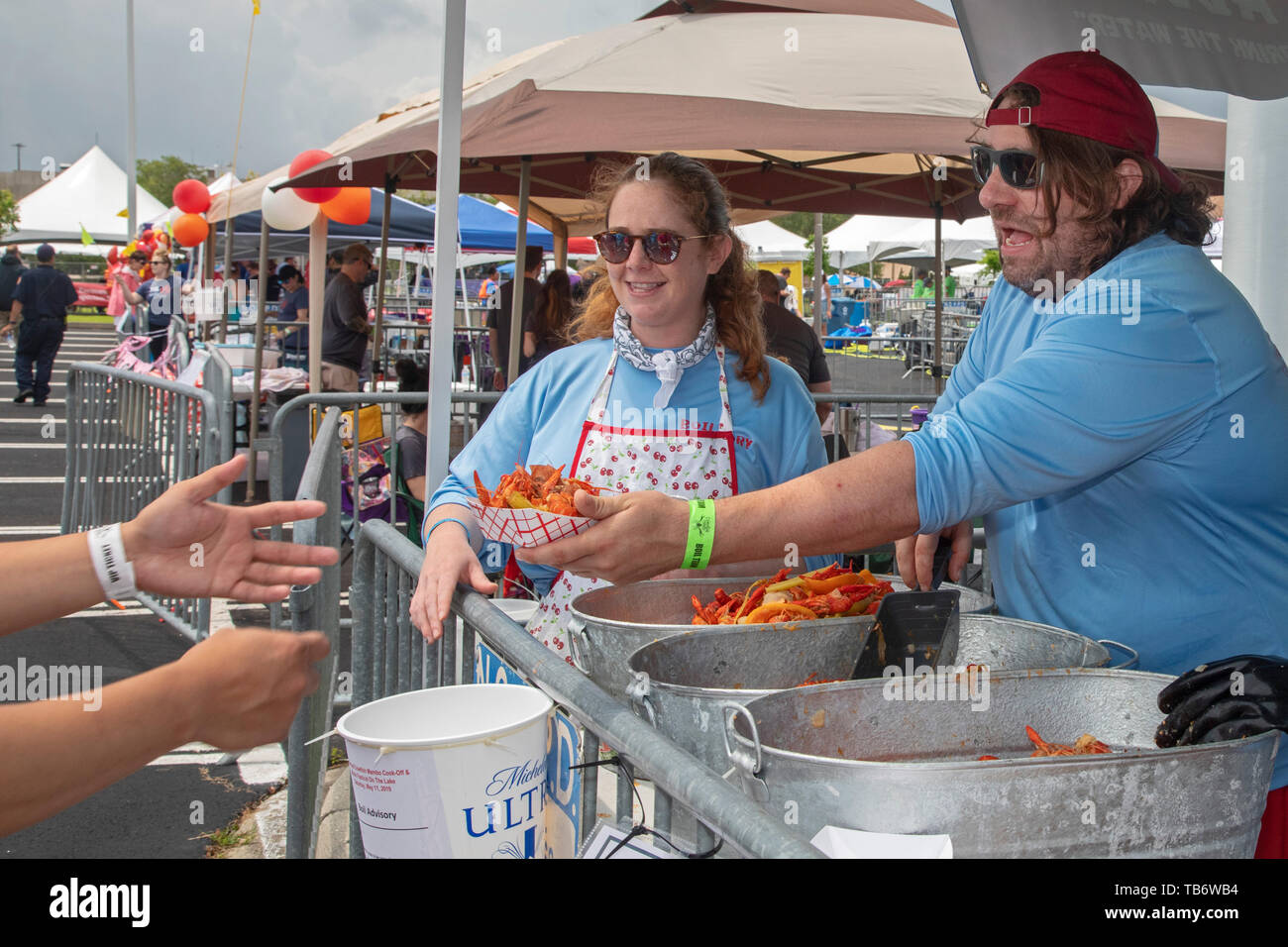 New Orleans, Louisiana - The Crawfish Mambo, an annual crawfish cook-off. Dozens of teams boil and serve crawfish, competing for prize money and bragg Stock Photo