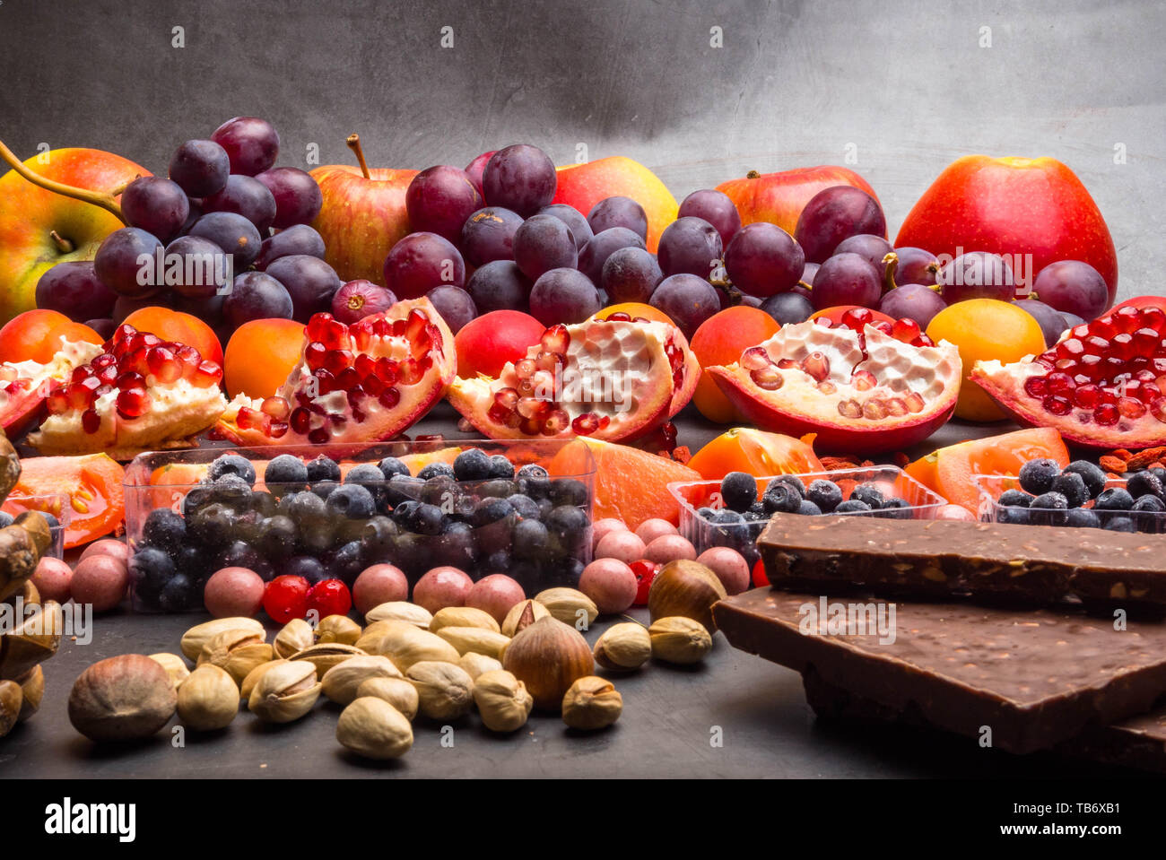 Healthy super food selection background as fruits, berry, chocolate