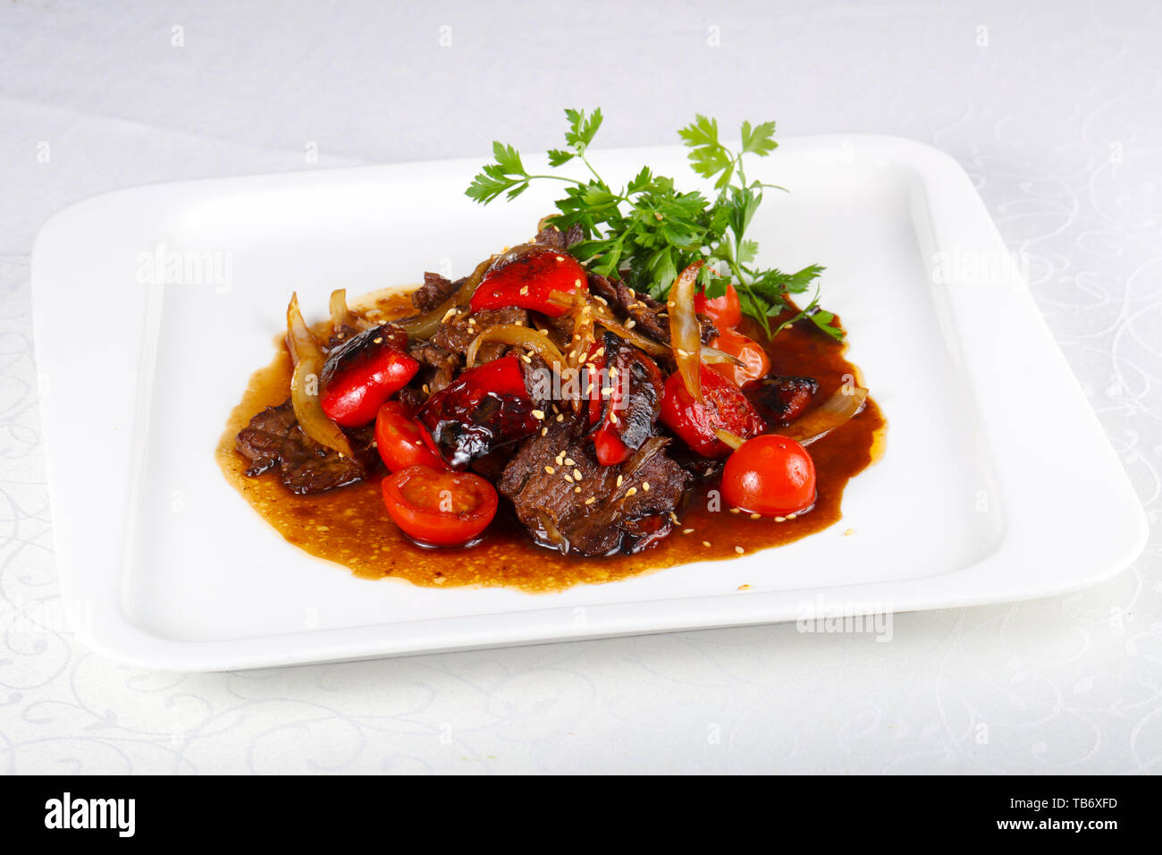 Beef in oyster sauce with tomato Stock Photo Alamy