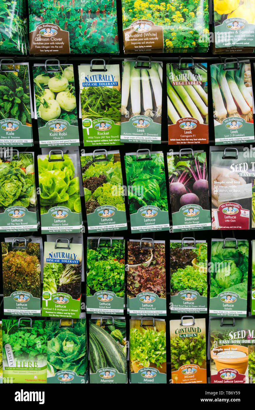 A display rack of packets of Mr Fothergill's vegetable seeds for sale in a garden centre shop. Stock Photo