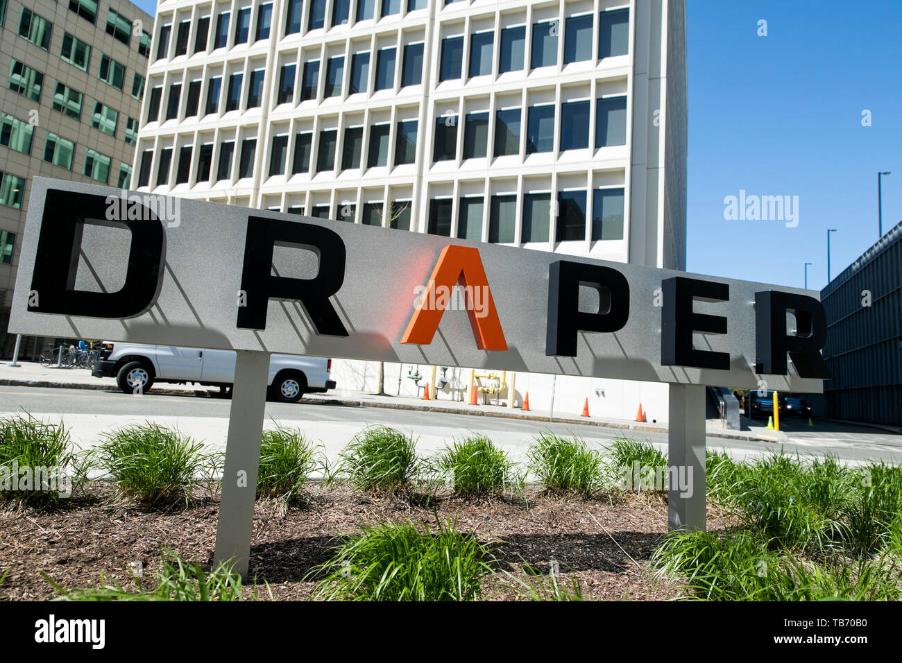 A logo sign outside of the headquarters of the Draper Laboratory in