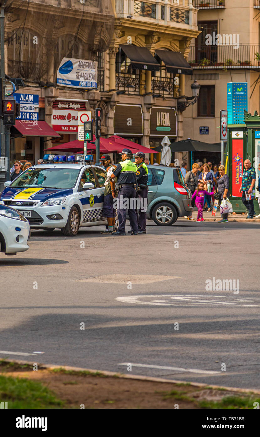 VALENCIA, SPAIN - September 25, 2016: Valencia police apprehend a purse snatcher after a run through cit streets Stock Photo