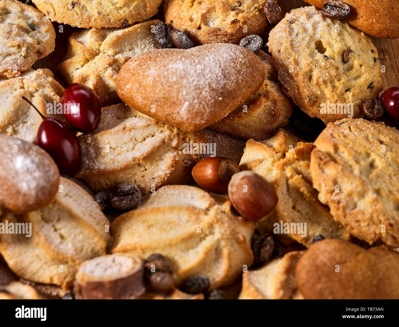 Oatmeal Cookies and sand chocolate cake with nut on table Stock Photo