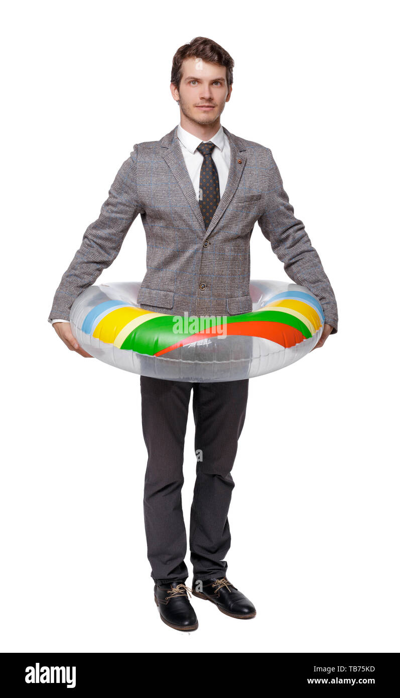 Front view of businessman with an inflatable circle. Isolated over white background. Young businessman in a suit in a lifebuoy. Concept Stock Photo