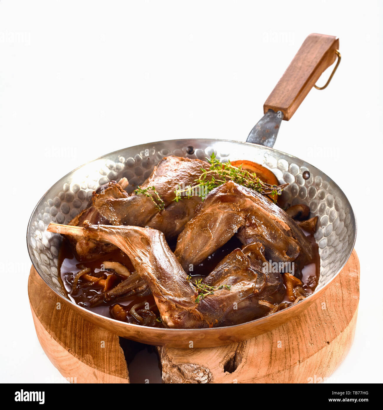 Quartered roasted wild rabbit seasoned with orange, herbs, garlic ...