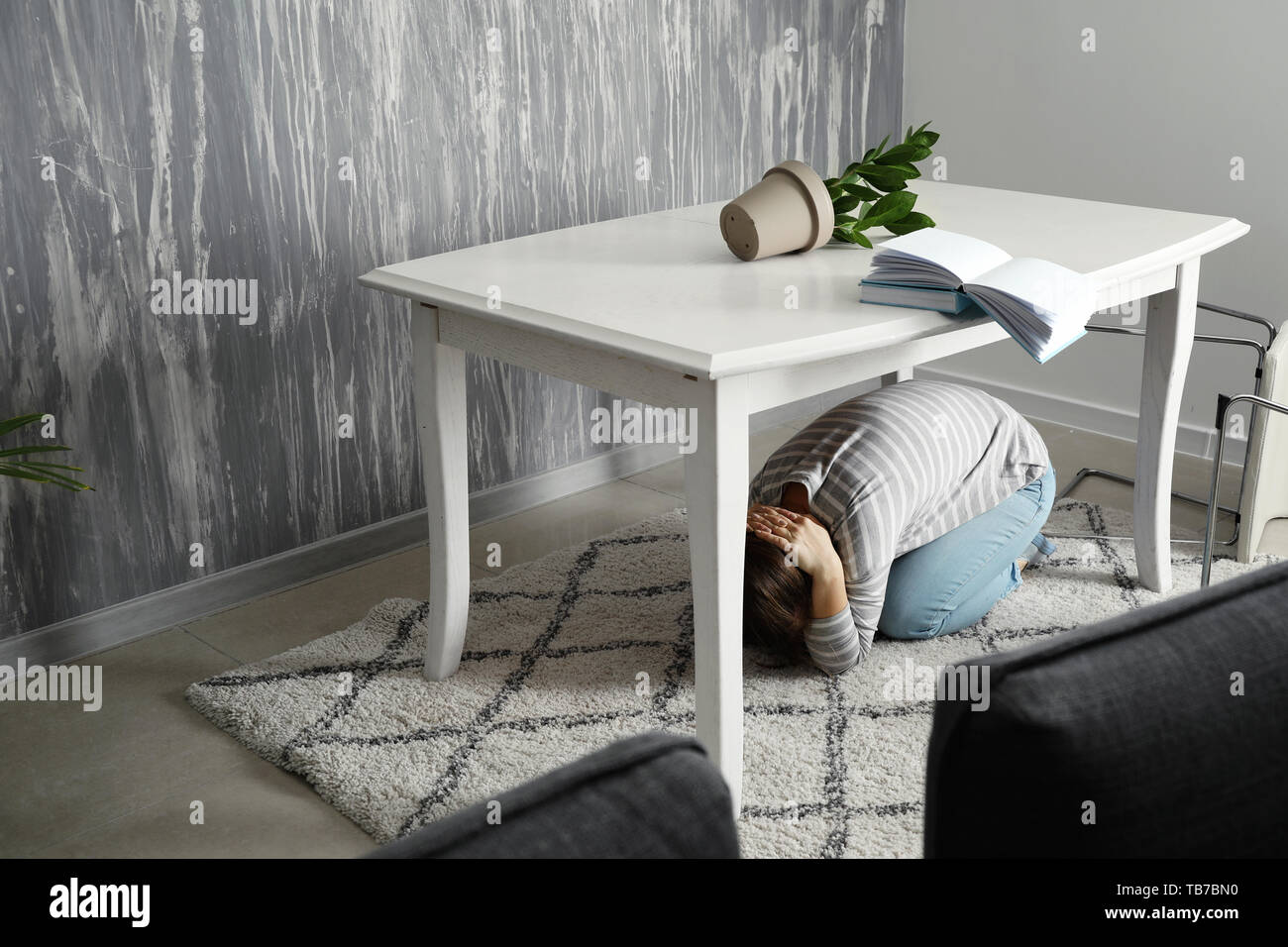 Hiding under table hires stock photography and images Alamy