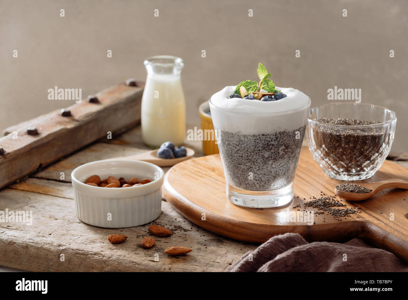 Chia pudding with berries and milk, sweet nourishing dessert, healthy breakfast superfood concept Stock Photo