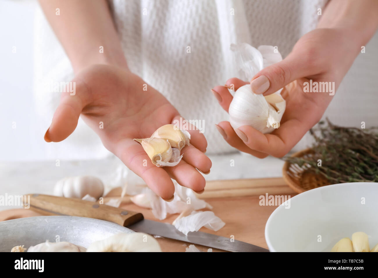 Woman peeling garlic hands knife hi-res stock photography and images ...