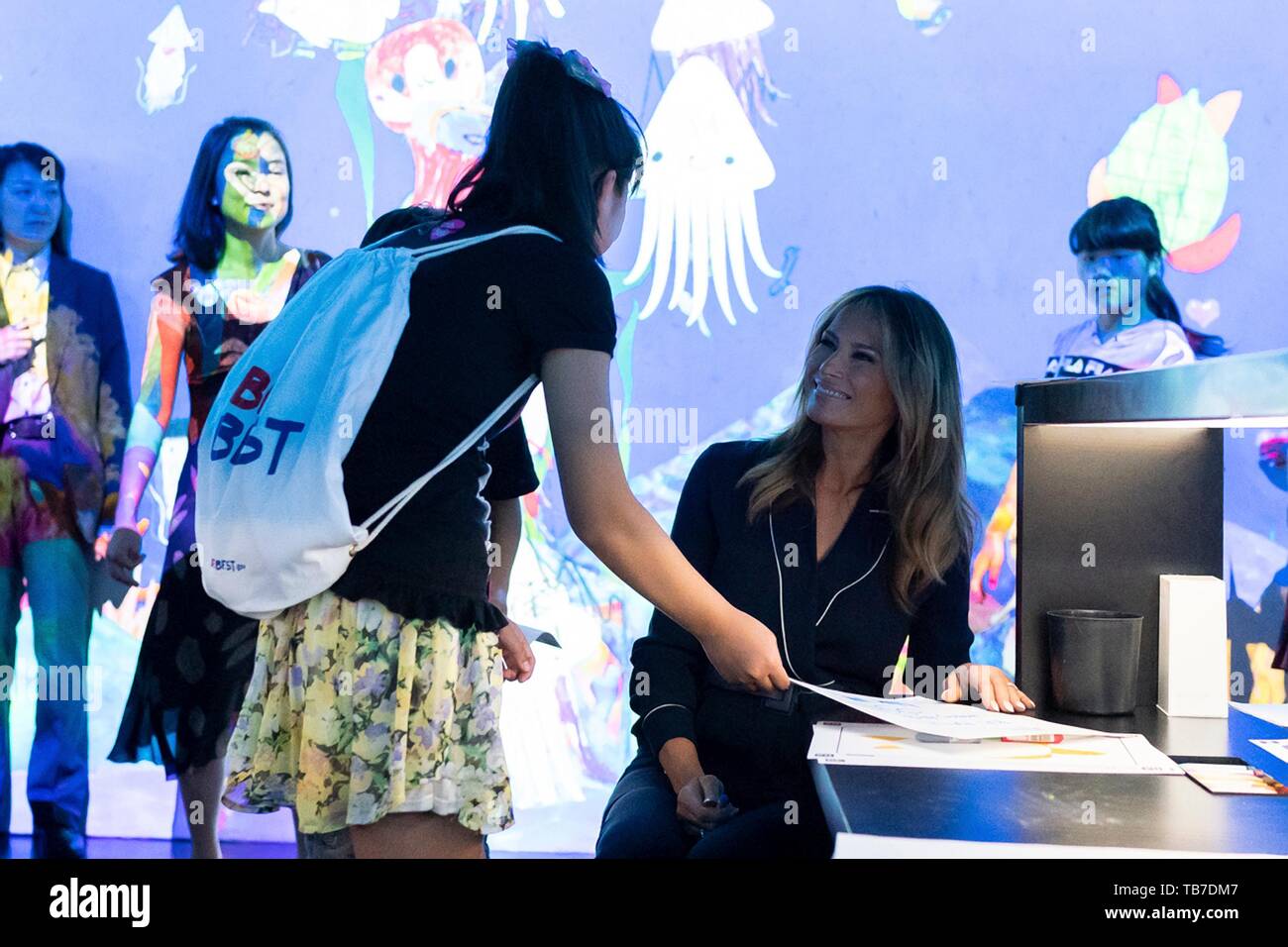 U.S. First Lady Melania Trump meets with schoolchildren creating Be Best artwork during her tour of the team Lab Borderless Exhibit at the Mori Building Digital Art Museum May 26, 2019 in Tokyo, Japan. Stock Photo