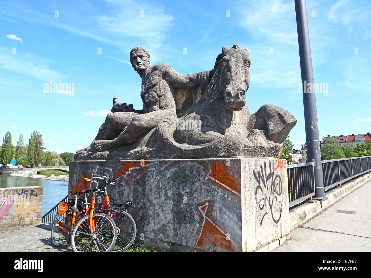 MUNICH, GERMANY - MAY 2, 2019 Sculpture group dated 1925 at the NW beginning of the Reichenbach bridge over the Isar river in Munich Stock Photo