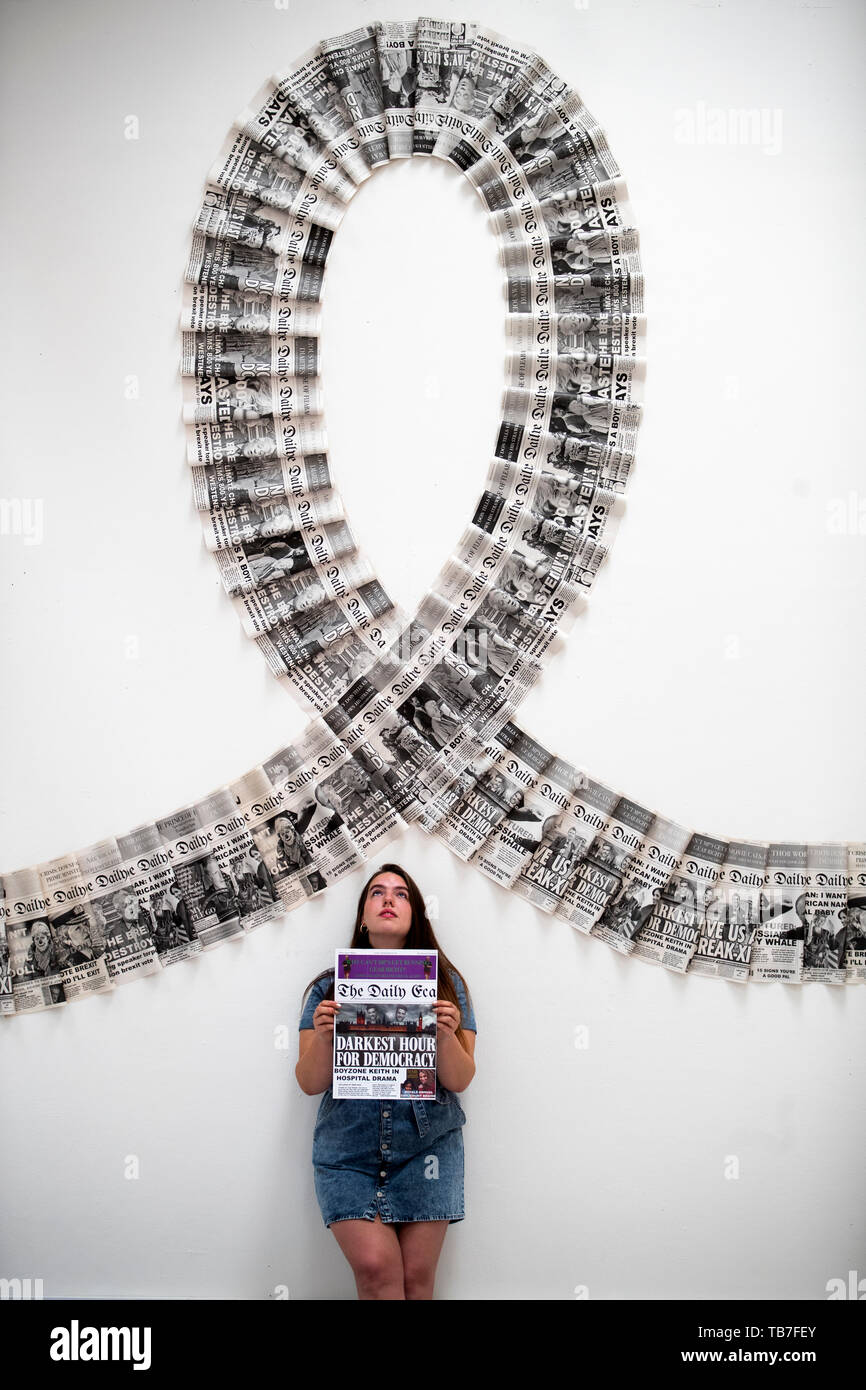 Sculpture student Lauren Holehouse with her installation titled Production Line at the media preview of the Edinburgh College of Art degree show in Edinburgh. Stock Photo