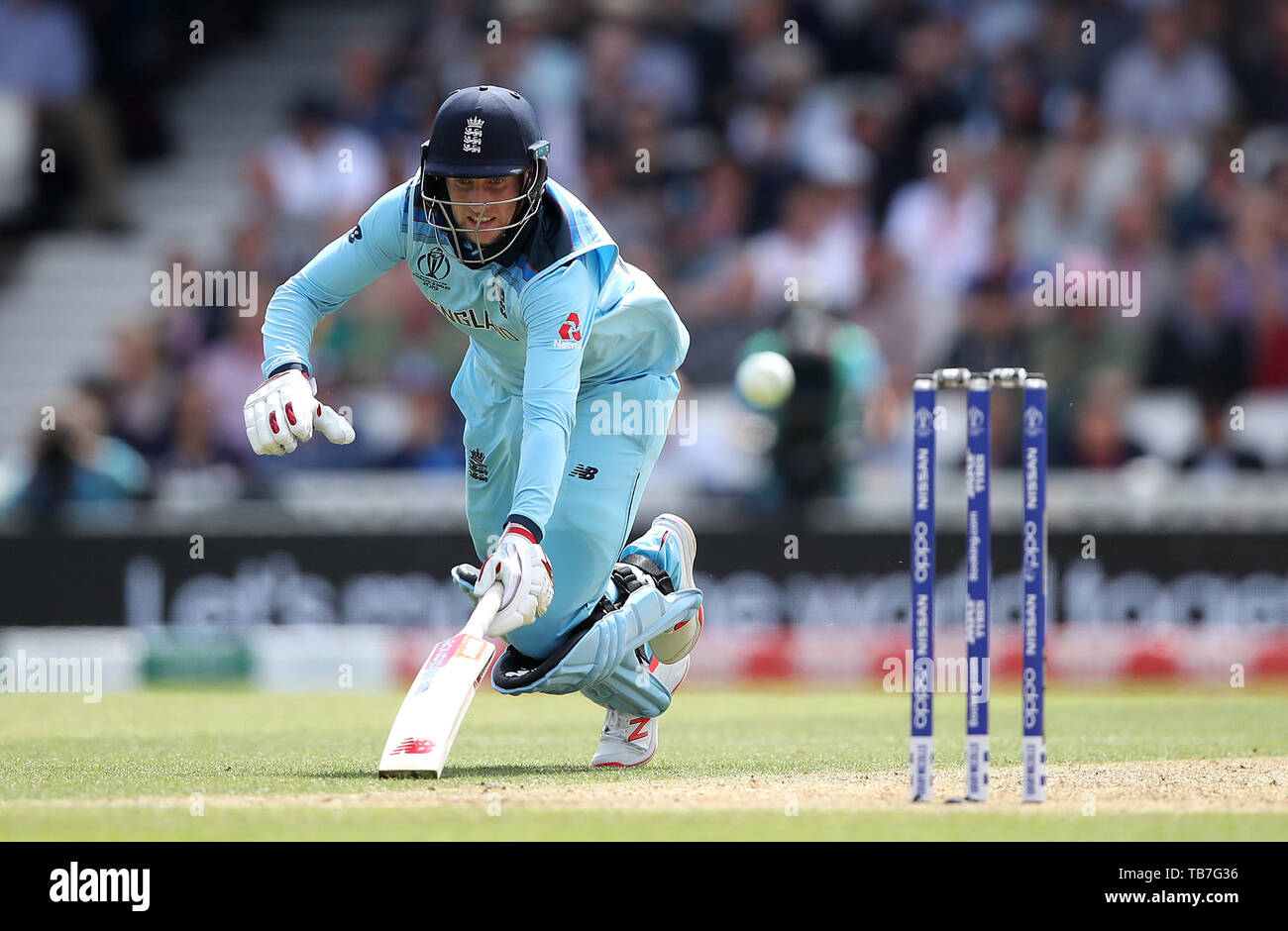 England's Joe Root dives to make his ground at the non-striker's end during the ICC Cricket World Cup group stage match at The Oval, London. Stock Photo