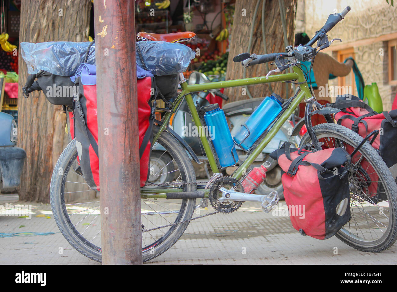 Ladakh, India: Dated- May 9, 2019: A mountain bike with bags and luggage parked at a market in Ladakh. Cycling in Ladakh. Mountain Biking in Ladakh Stock Photo
