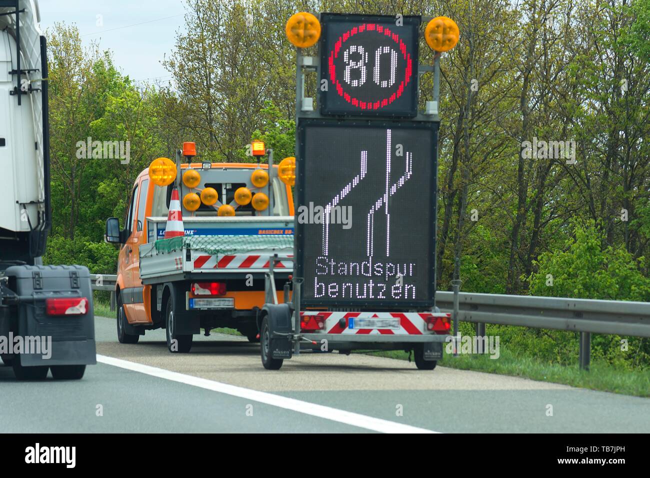 Warnings with a vehicle of the motorway maintenance authorities on the highway, Germany Stock Photo